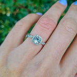 Anillo de Compromiso Diamante Halo y Aguamarina Trenzado